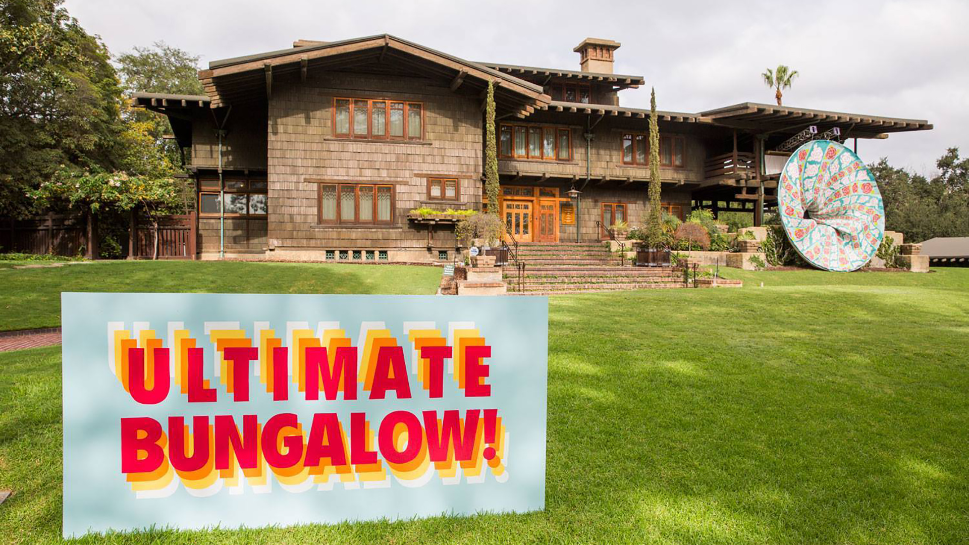 Sign that reads "Ultimate Bungalow" on lawn of Pasadena's Gamble House.