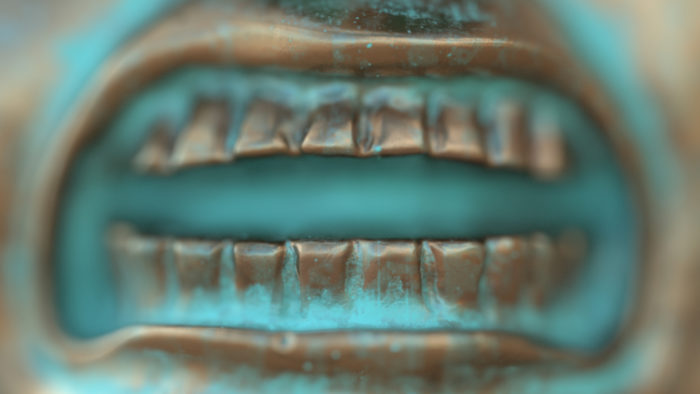 A close- up of a graphically rendered teeth protruding a bronze mouth.