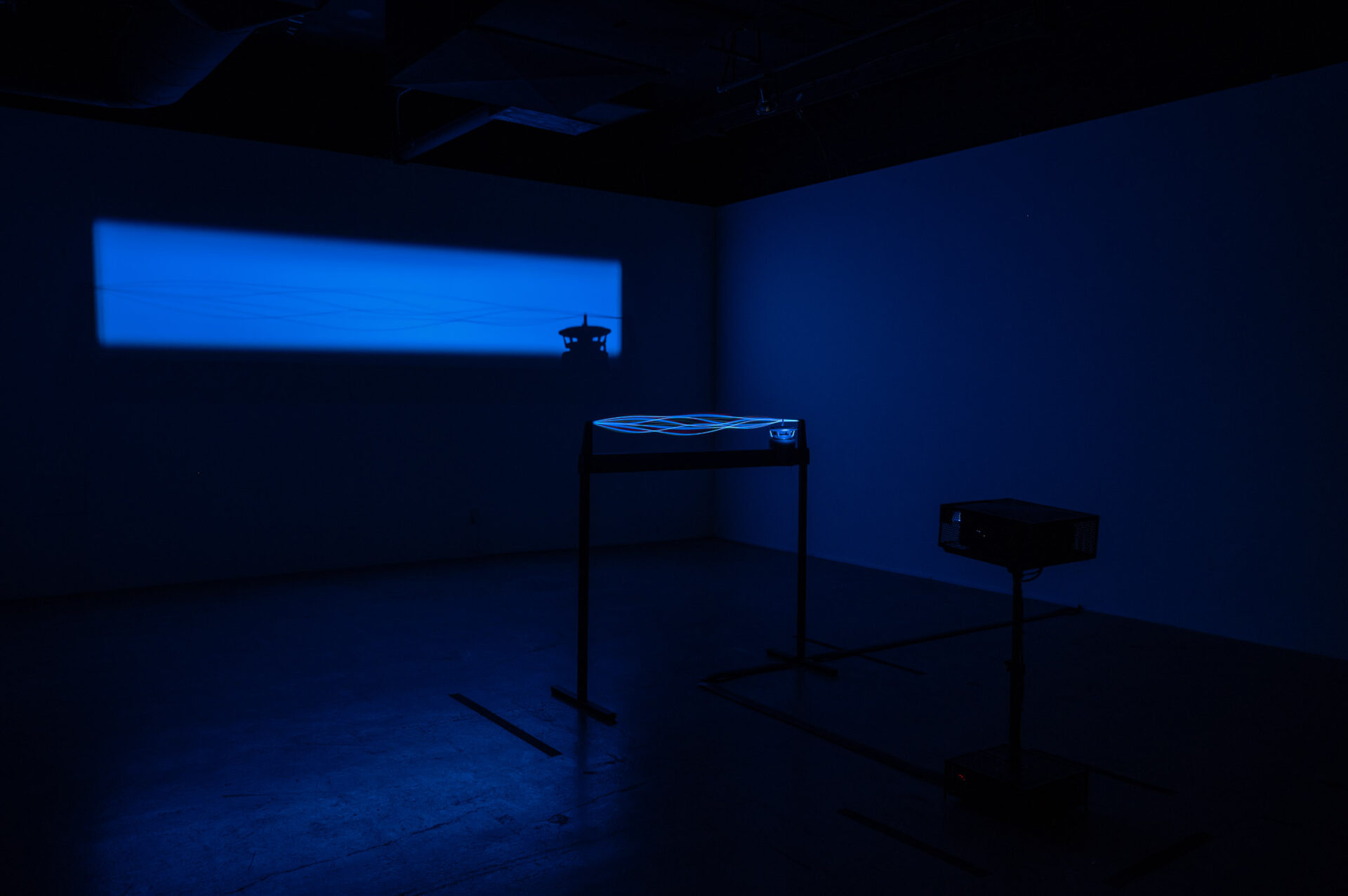 Alba Triana, Music on a Bound String No. 2, 2015. Visible sound interacting with a projected light beam. Installation view at Energy Fields: Vibrations of the Pacific, co-presented by Fulcrum Arts & Chapman University.
Photo by Christopher Wormald.